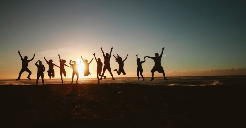 Eco-friendly Travel - Silhouette Photography of Group of People Jumping during Golden Time