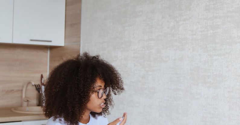 Kitchen Gadgets - A Woman Talking while on a Video Call