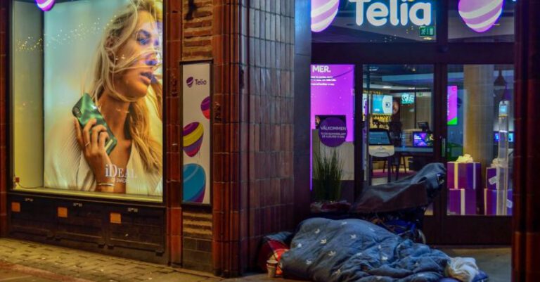 Boutique Stores - Person Sleeping In Pavement Near Glass Window