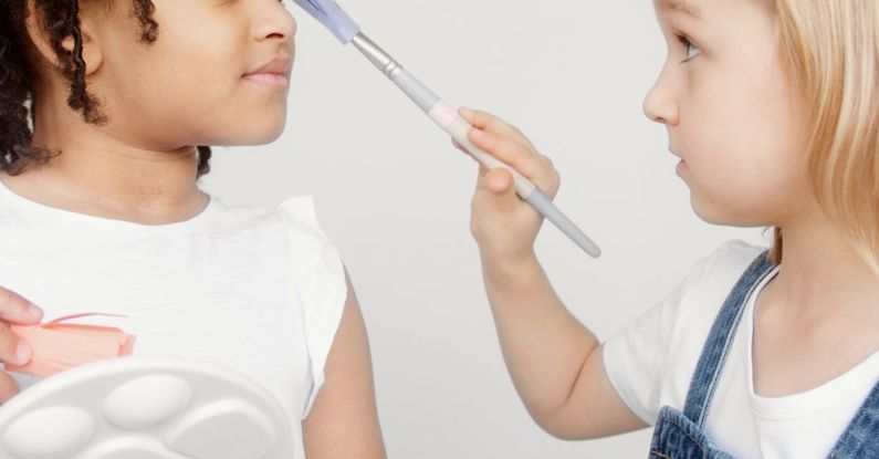 Innovative Fashion - Two Kids Holding a Paintbrush and a Palette