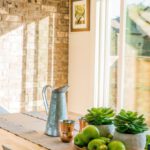 Home Decor - Black Kettle Beside Condiment Shakers and Green Fruits and Plants on Tray on Brown Wooden Table