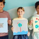 Upcycling Projects - Young Students Holding their Art Projects