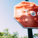 Warning Sign - Red Stop Signage Under Clear Blue Sky