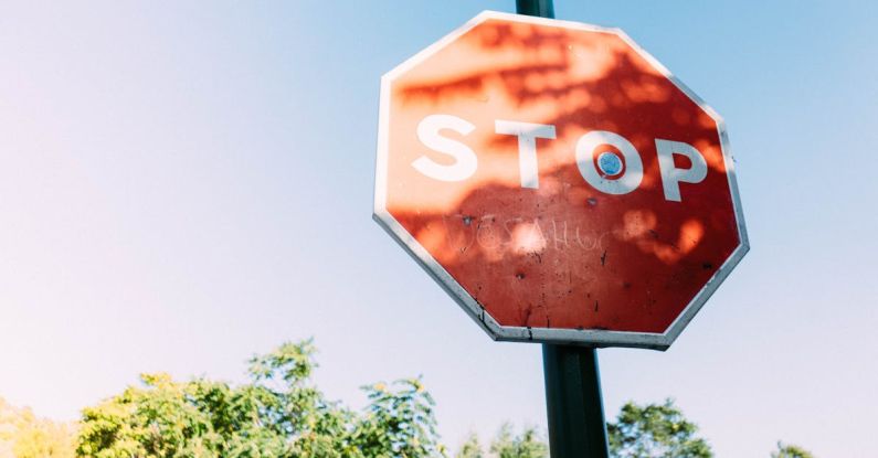 Warning Sign - Red Stop Signage Under Clear Blue Sky