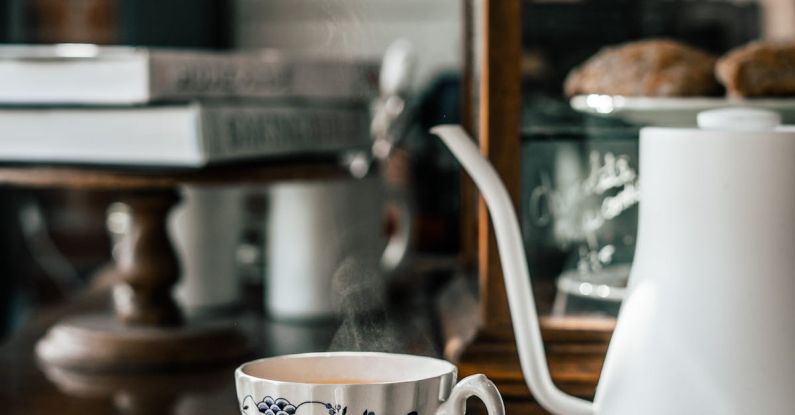 Appliances Sale - Ornamental cup near kettle in modern cafeteria