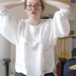 Home Office Fashion - Shocked female worker in modern workplace