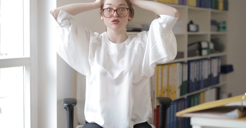 Home Office Fashion - Shocked female worker in modern workplace