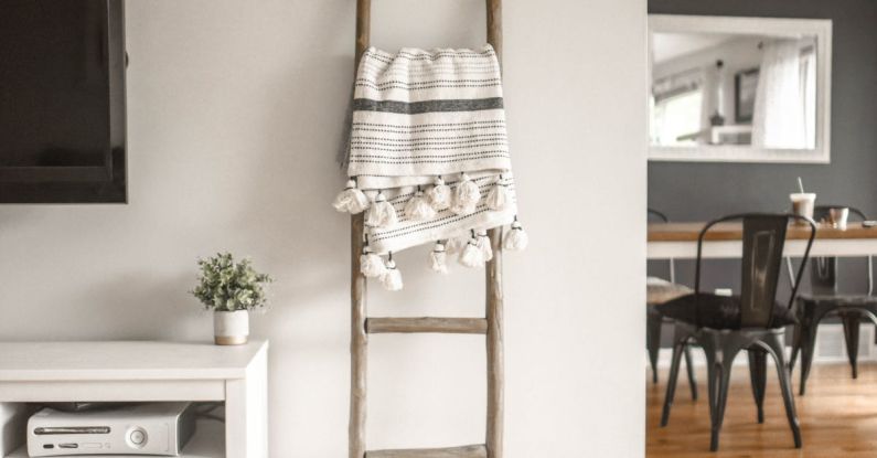 Home Furnishings - Gray Wooden Ladder on White Painted Wall