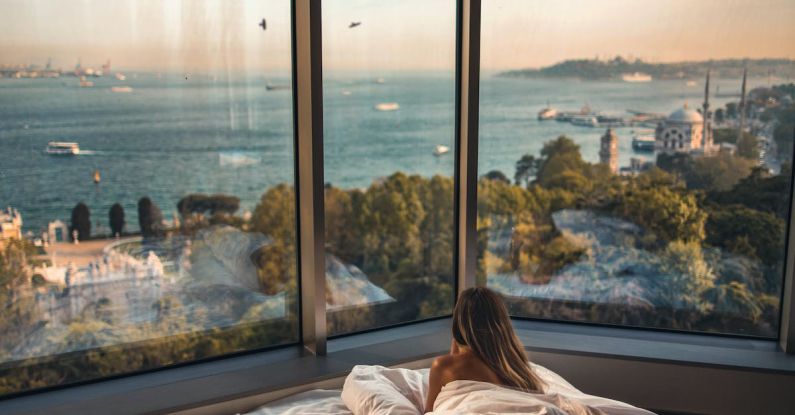 Cozy Bedroom - Woman Laying Down on Bed Inside Room