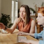 Smart Parenting - Photo Of Woman Tutoring Young Boy